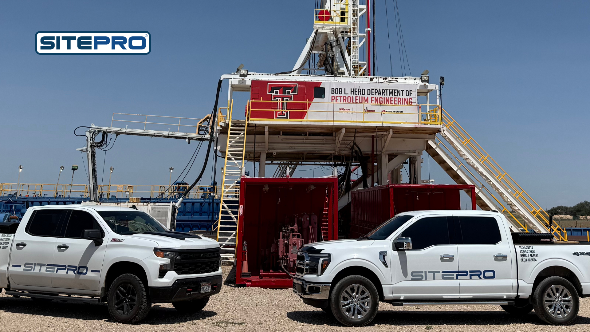 SitePro trucks parked in front of a drilling rig at the Texas Tech Department of Petroleum Engineering